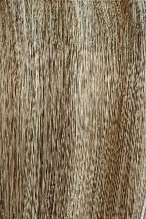 Gisela Mayer Linda HH Deluxe in dark shade, three-quarter view showing the rich dark tone on the mid-length natural hair wig.