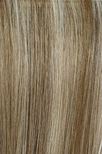 Gisela Mayer Linda HH Deluxe in dark shade, three-quarter view showing the rich dark tone on the mid-length natural hair wig.