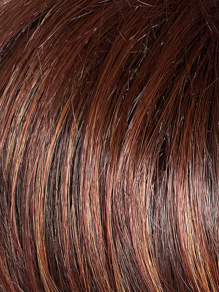 Magic Rock in Fashion Auburn by Gisela Mayer, side view showing the bold auburn balayage and dynamic mid-length cut.