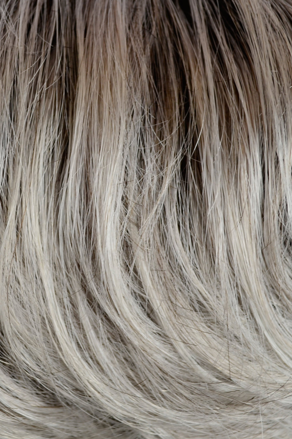 Gisela Mayer Magic Fresh in Light Grey Rooted, side view showing the contemporary grey shade on the modern short cut wig.