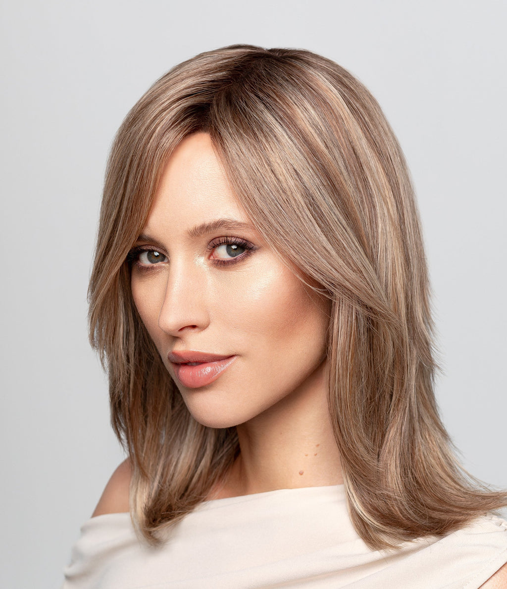 Euro Como wig by Gisela Mayer in Bernstein Rooted, side view showing the warm golden tone on the mid-length natural hair wig.