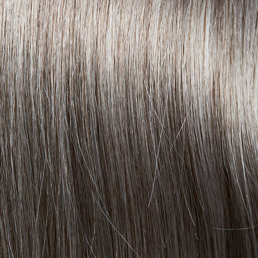 Gisela Mayer Anna Mono Lace in GM56-58-36 grey mix, three-quarter angle showing the modern grey tones on the short wavy wig.