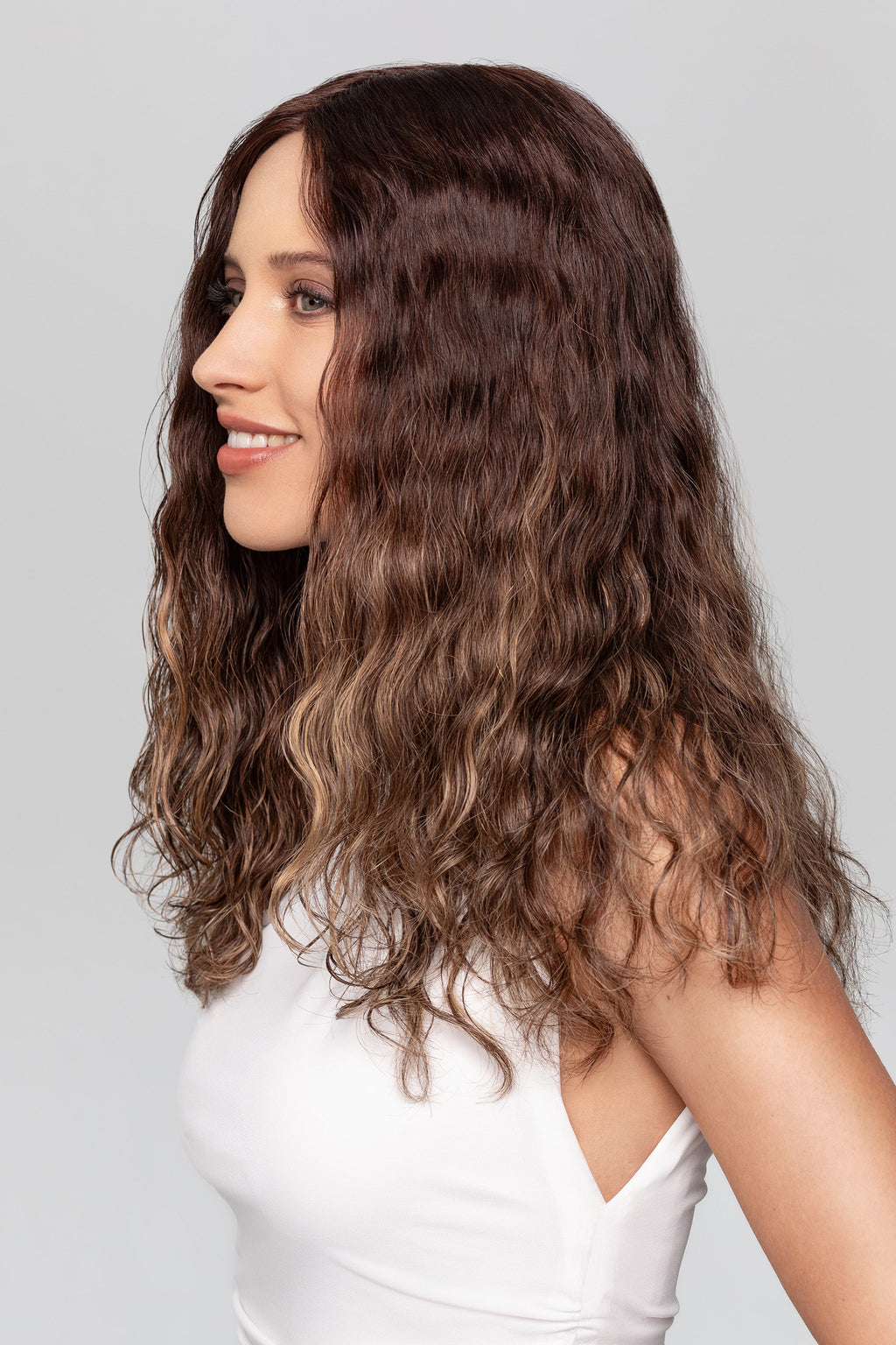 HH Remy Super Curl wig by Gisela Mayer, side view showing the long bouncy curls and 100% Remy natural hair texture.