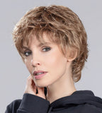 Keira wig by Ellen Wille, lifestyle view showing the short feathered cut and natural volume of the synthetic fiber.