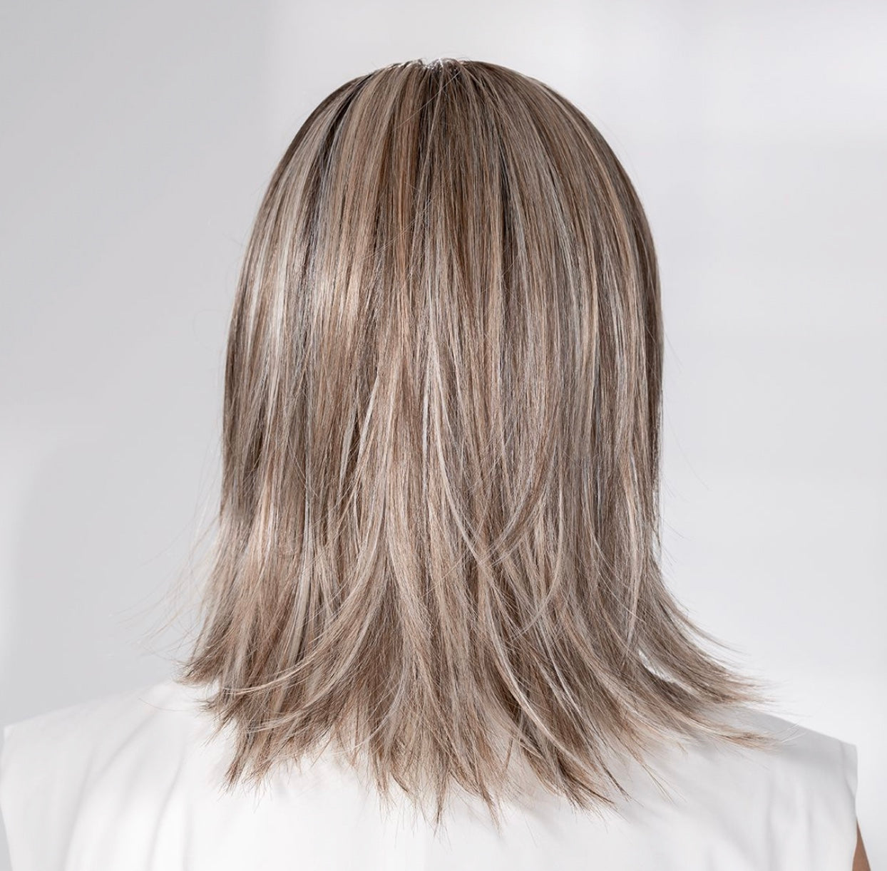 Ellen Wille Whisper Comfort, three-quarter view showing the shoulder-length silhouette and elegant side piece.
