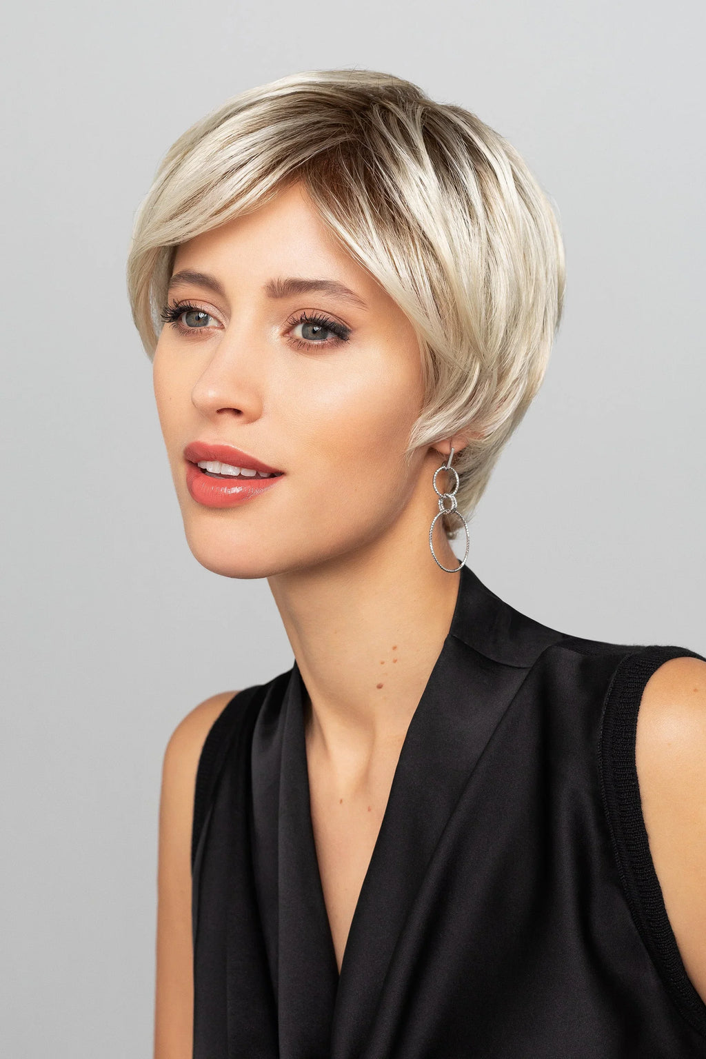 Leilah Mono Small wig by Gisela Mayer in Champagne Rooted shade, side view showing the light blonde tone on the short synthetic wig.