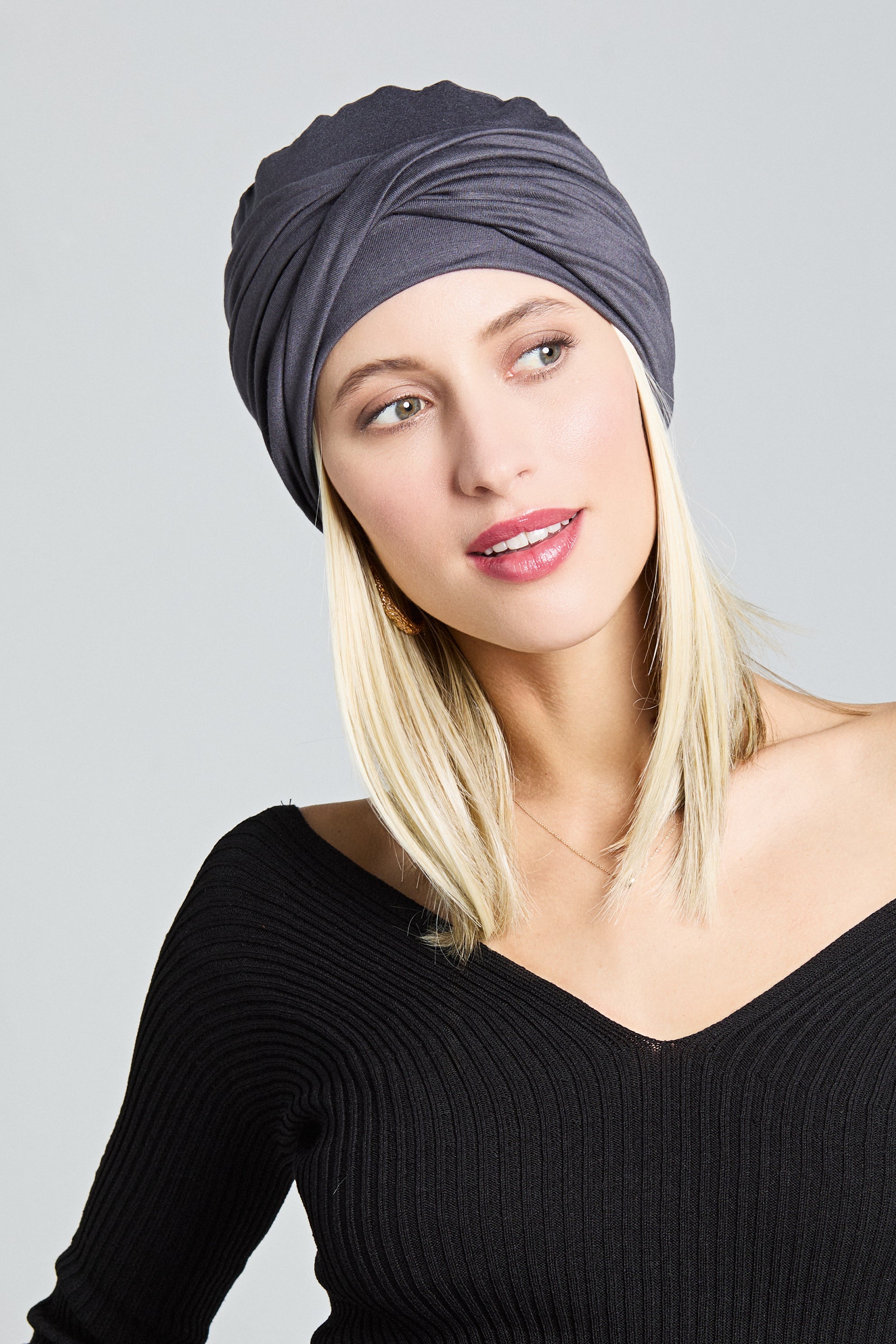 Malou turban by Gisela Mayer worn elegantly - warm golden shade, soft draped fabric for sensitive scalps