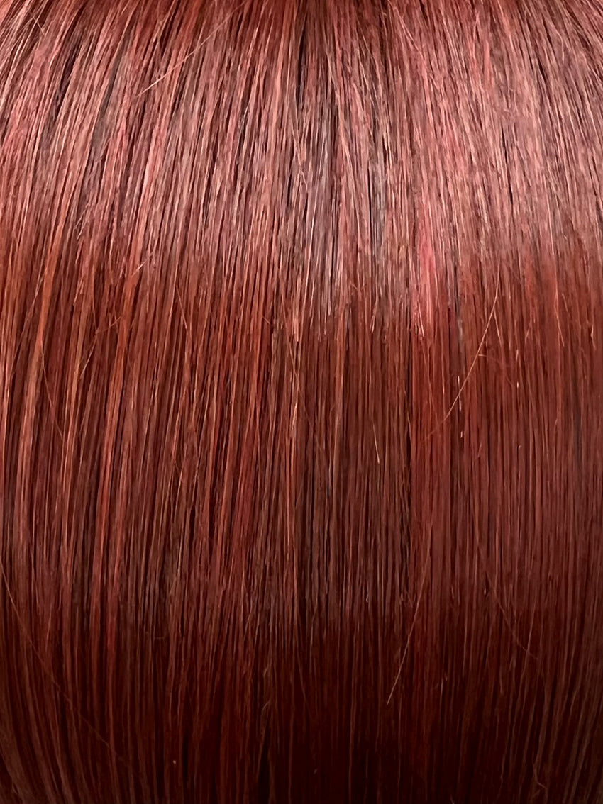 Magic Spicy in Chestnut Mix by Gisela Mayer, three-quarter view showing the rich warm tones on the structured mid-length synthetic wig.
