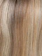 Euro Coco Deluxe by Gisela Mayer, front profile showing the feminine mid-length natural hair style and light volume.