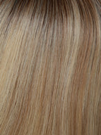 Prime Class Lace by Gisela Mayer, rear view showing the neatly shaped mid-length natural hair cut.