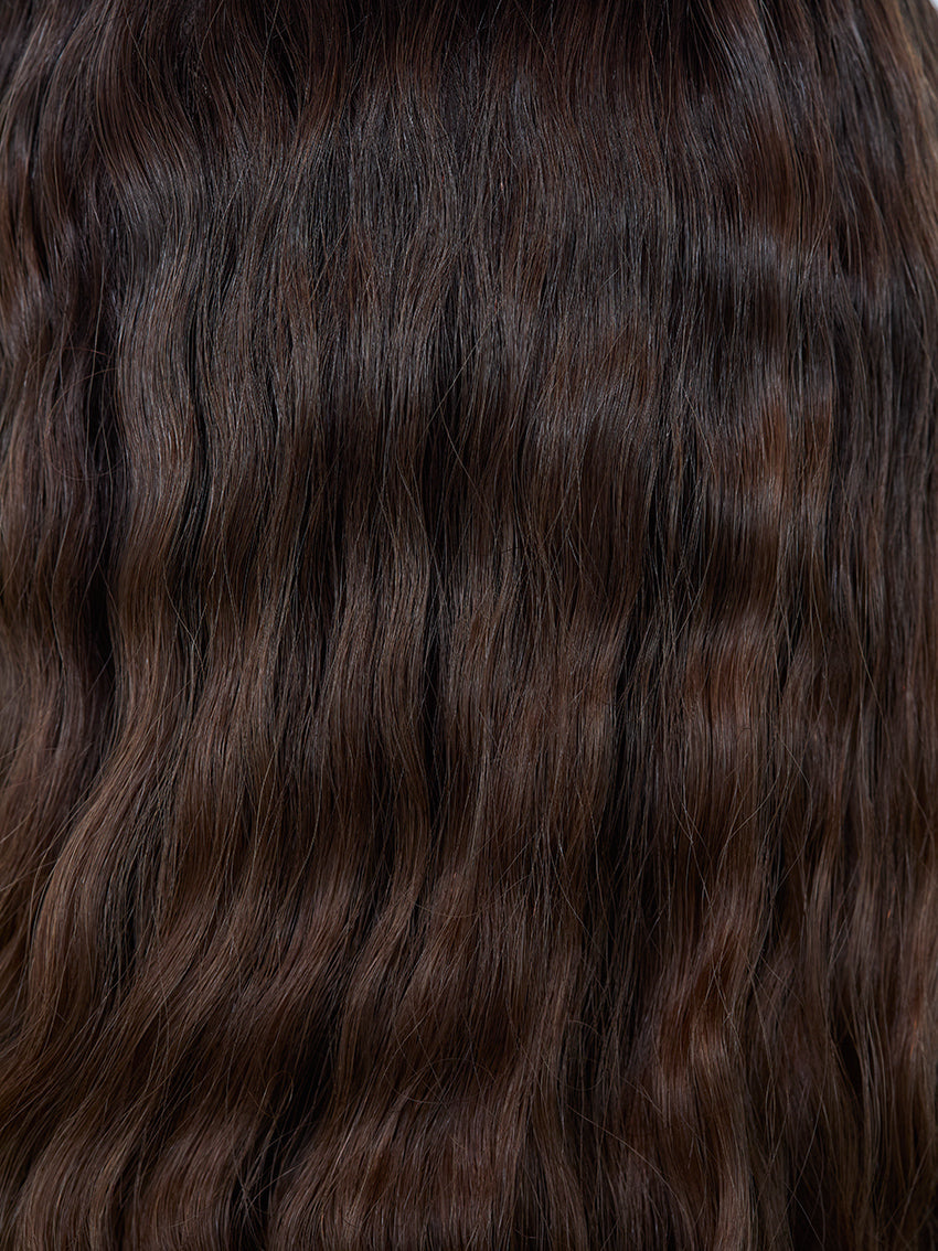 Gisela Mayer HH Remy Super Curl, three-quarter view showing the voluminous curly long style and double monofilament construction.