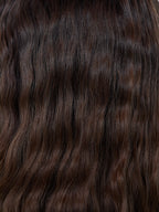 Gisela Mayer HH Remy Super Curl, three-quarter view showing the voluminous curly long style and double monofilament construction.