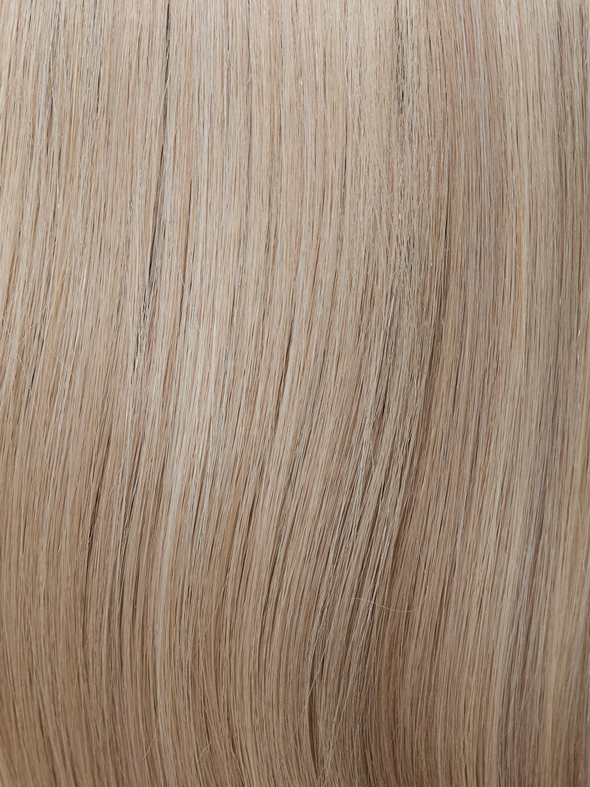 Gisela Mayer HH Remy Energy, three-quarter rear view showing the long fluid natural hair and natural hair texture.