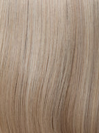 Gisela Mayer HH Remy Energy, three-quarter rear view showing the long fluid natural hair and natural hair texture.