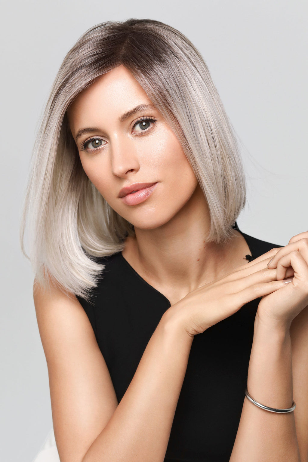 Magic Coco Small wig by Gisela Mayer, lifestyle view showing the sleek mid-length angled bob and heat-resistant synthetic fiber.