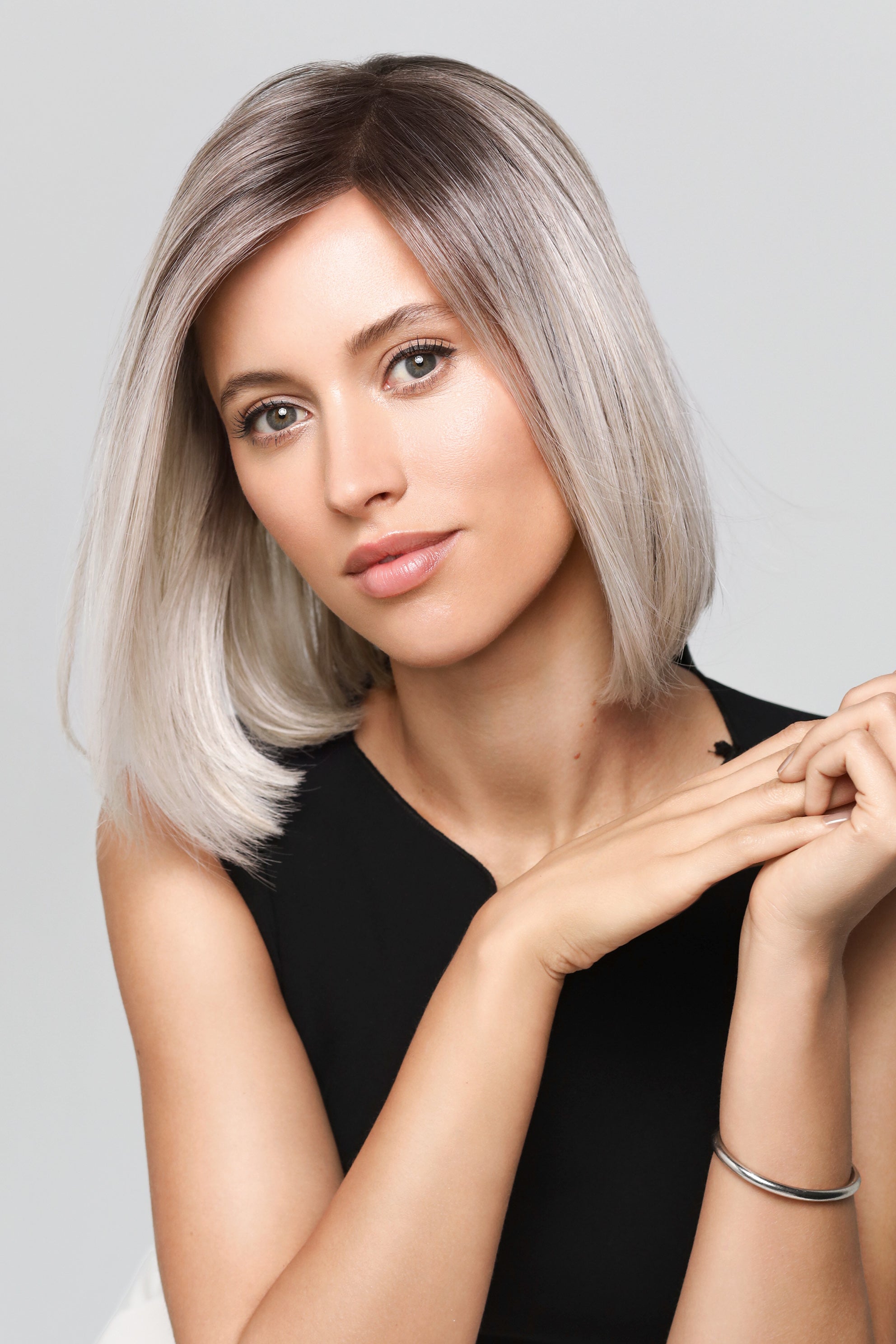 Magic Coco Small wig by Gisela Mayer, lifestyle view showing the sleek mid-length angled bob and heat-resistant synthetic fiber.