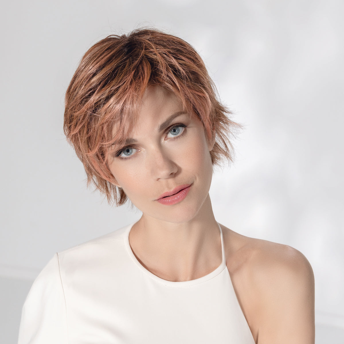 Avenue Soft wig by Ellen Wille in Rosewood Rooted, lifestyle view showing the short feathered cut and modern voluminous top.