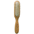 Brosse Purepower, idéale pour démêler et coiffer vos perruques femme en cheveux naturels sans abîmer les fibres.
