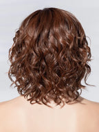 Ellen Wille Eclat Deluxe, three-quarter view showing the mid-length silhouette and elegant feminine drape.