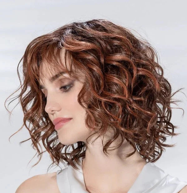 Eclat Deluxe wig by Ellen Wille, lifestyle side view showing the mid-length style and heat-resistant synthetic fiber.