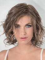 Eclat Deluxe in Bernstein by Ellen Wille, side profile showing the warm golden tone on the mid-length heat-resistant wig.