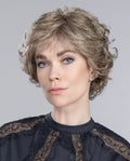 Front view of a woman wearing the elegant Ellen Wille Aurora Comfort wig, showcasing its classic short layered cut and subtle waves.