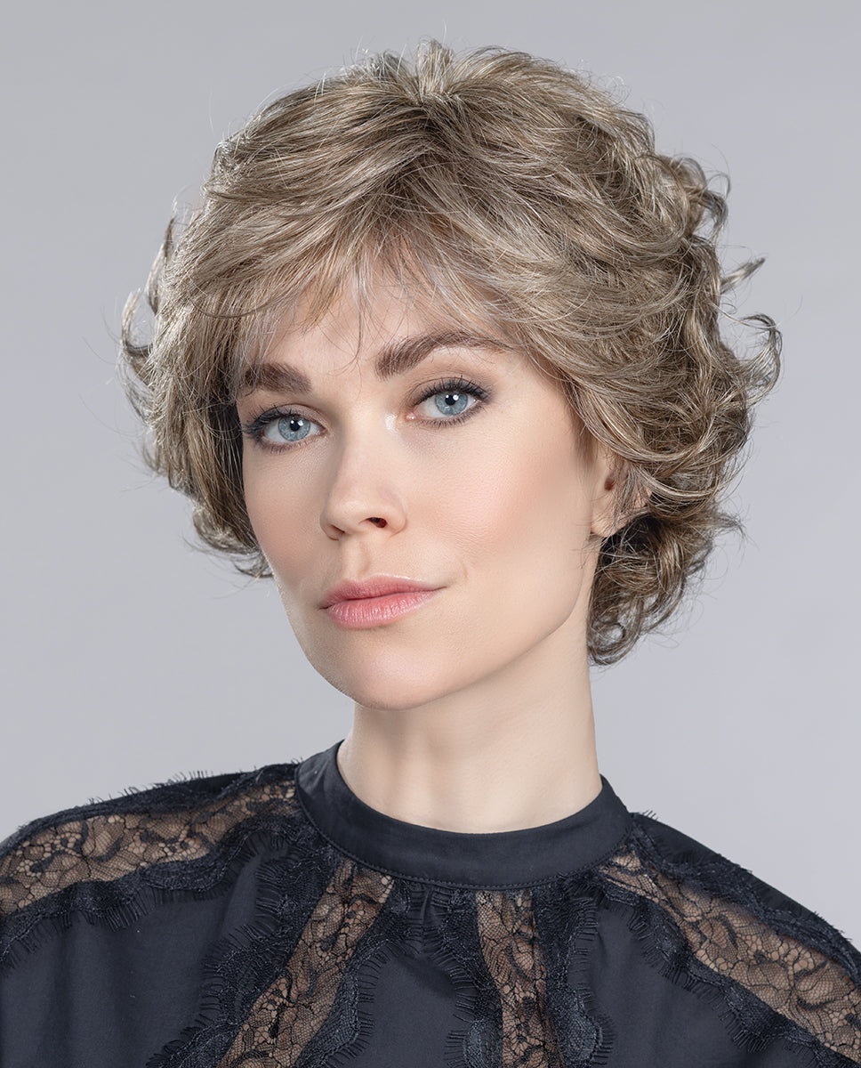 Front view of a woman wearing the elegant Ellen Wille Aurora Comfort wig, showcasing its classic short layered cut and subtle waves.