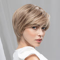 Front view of a woman modeling the short, layered Ellen Wille Award Deluxe human hair wig, highlighting its elegant shape and face-framing fringe.