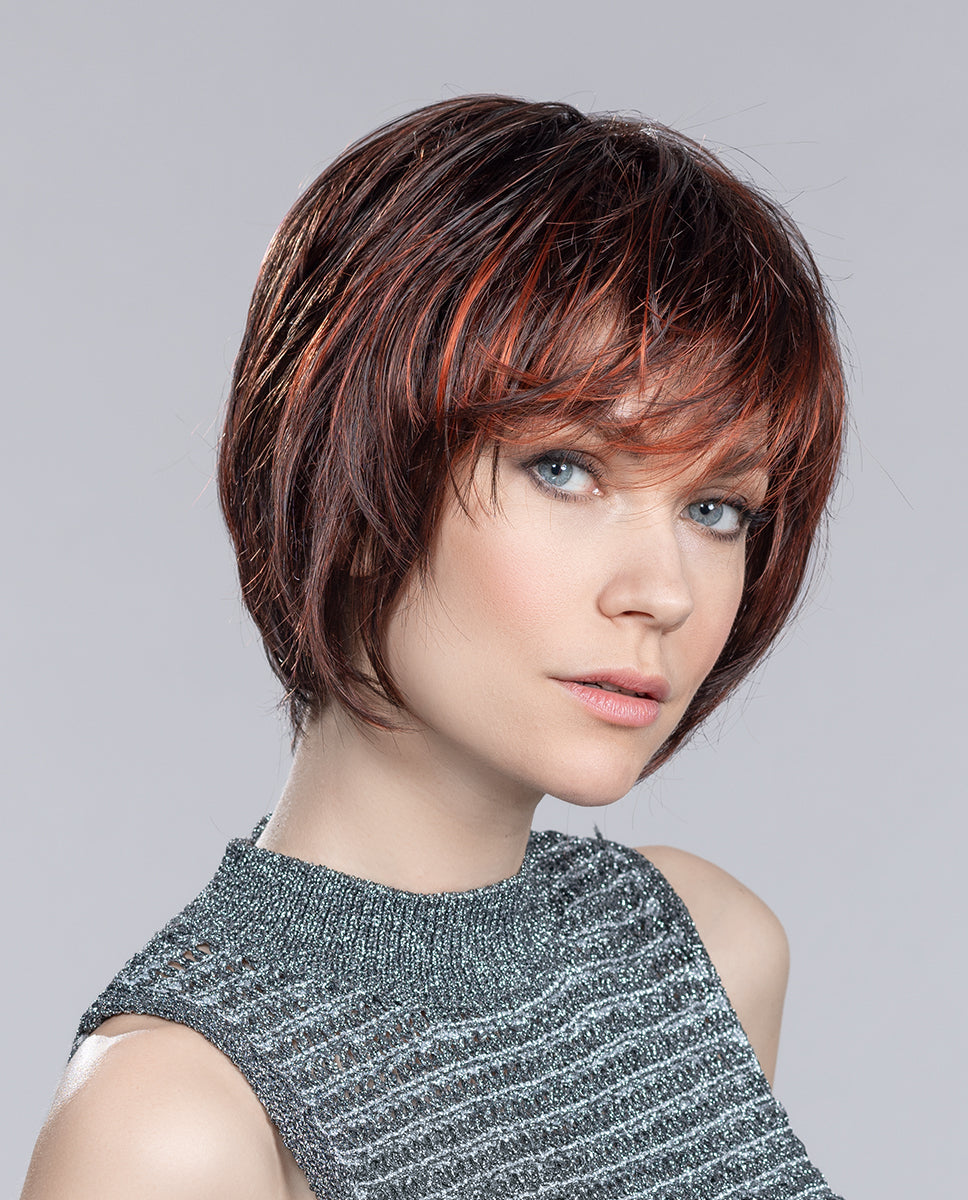 A woman wearing the Ellen Wille Beam short bob wig, highlighting its jaw-length tapered cut and natural invisible lace front.