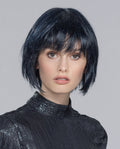 A woman wearing the Ellen Wille Blues short bob wig, showcasing its lightweight fringe, natural face-framing layers, and modern tapered nape.