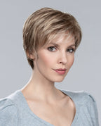Front view of a woman wearing the Cara 100 Deluxe short sporty wig by Ellen Wille, showcasing its dynamic pixie cut.