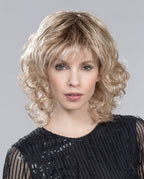 Front view of a woman wearing the bold Ellen Wille Cat wig, showcasing its short texturized waves and voluminous, wild silhouette.