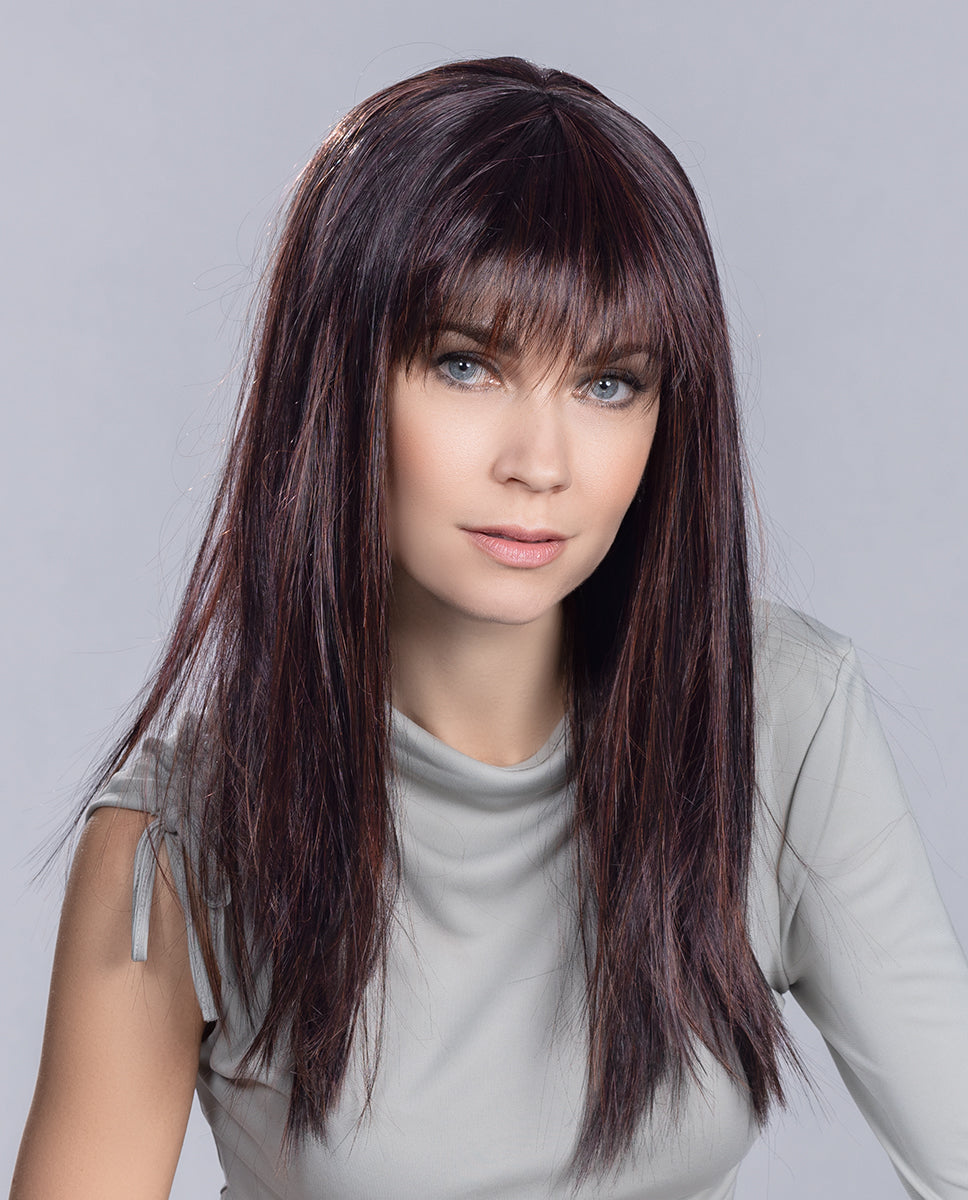 Front view of a woman wearing the long, sleek, and perfectly straight Ellen Wille Cher synthetic wig.