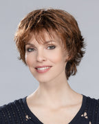 Profile view of a woman wearing the Ellen Wille Club 10 short wig, showcasing its tapered texture and natural volume at the back of the crown.