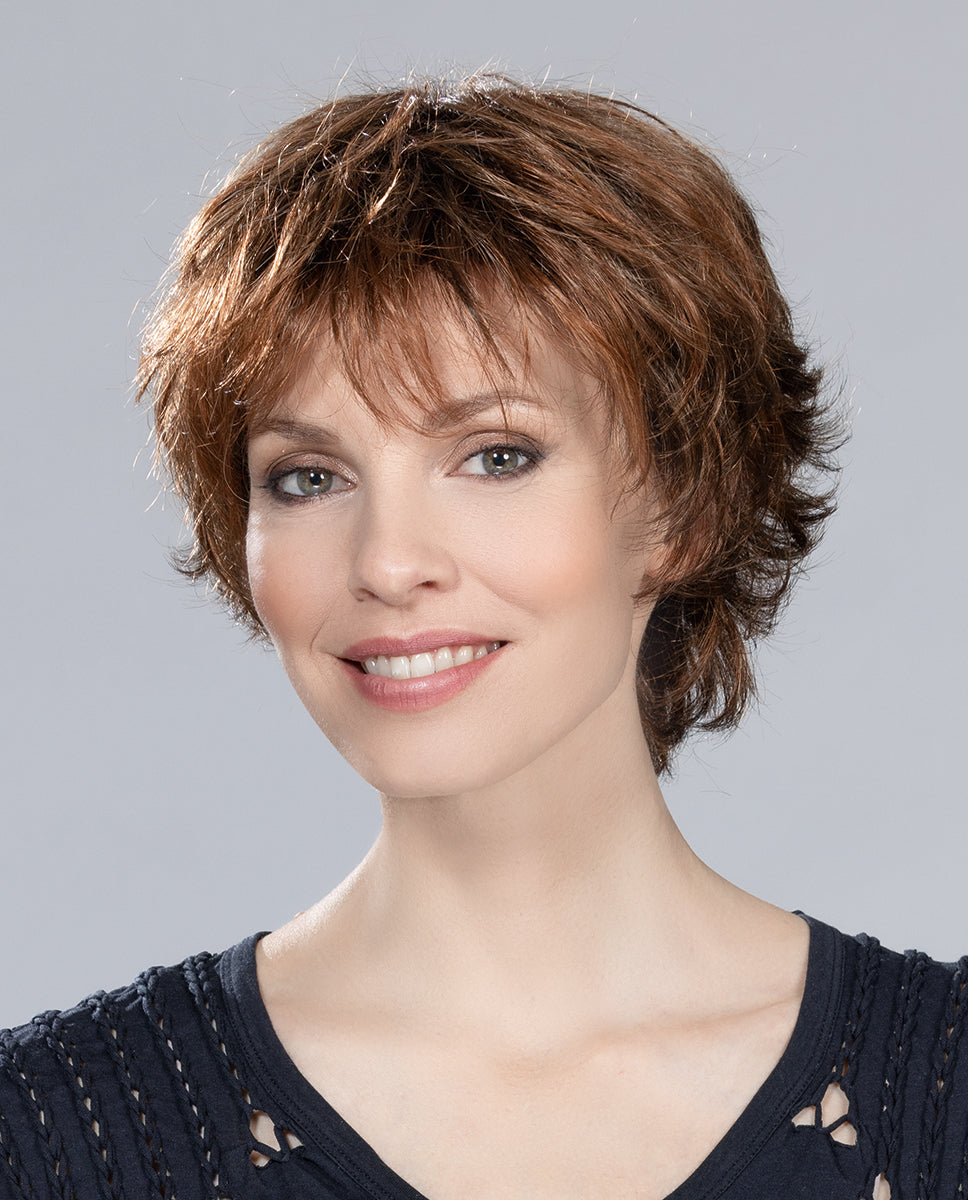 Profile view of a woman wearing the Ellen Wille Club 10 short wig, showcasing its tapered texture and natural volume at the back of the crown.