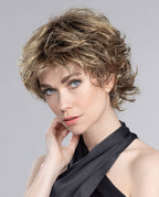Front view of a woman wearing the Ellen Wille Daily Large wig, showcasing its refined short wavy layers and comfortable large-sized cap fit.