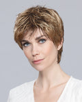 Profile view of a woman wearing the Ellen Wille Fair Mono wig, showcasing its natural monofilament top, tapered neckline, and chic texturized fringe.