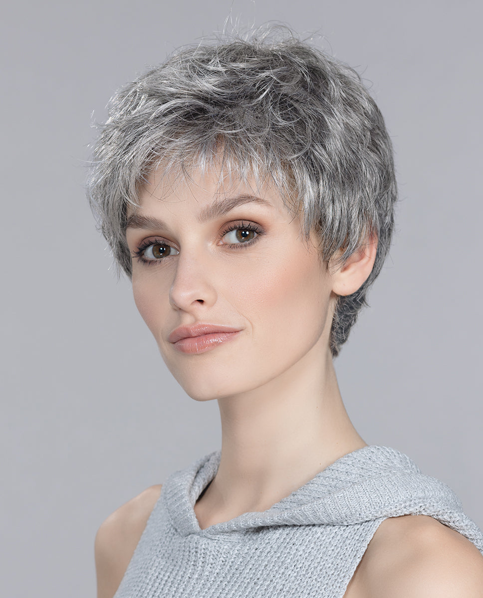 Front view of a woman wearing the Ellen Wille Foxy Small short wig, highlighting its secure petite cap fit and fresh, texturized sporty pixie layers.