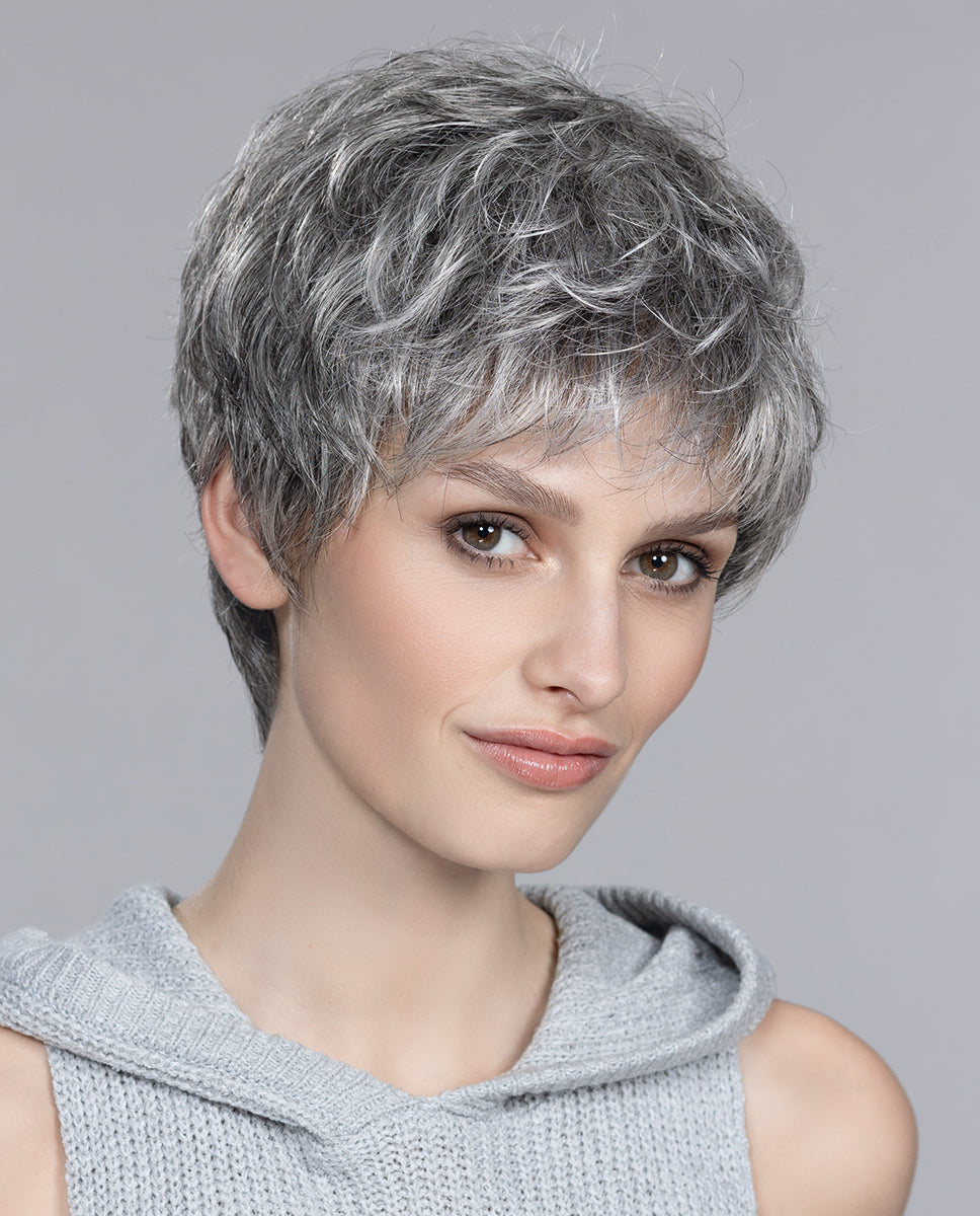 Front view of a woman wearing the Ellen Wille Foxy short wig, highlighting its sporty tapered layers and fresh, texturized pixie silhouette.