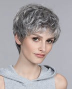 Front view of a woman wearing the Ellen Wille Foxy short wig, highlighting its sporty tapered layers and fresh, texturized pixie silhouette.