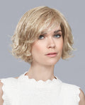 Front view of a woman wearing the Ellen Wille Like Mono Part wig, showcasing its elegantly tapered short bob cut and stylish side-swept fringe.