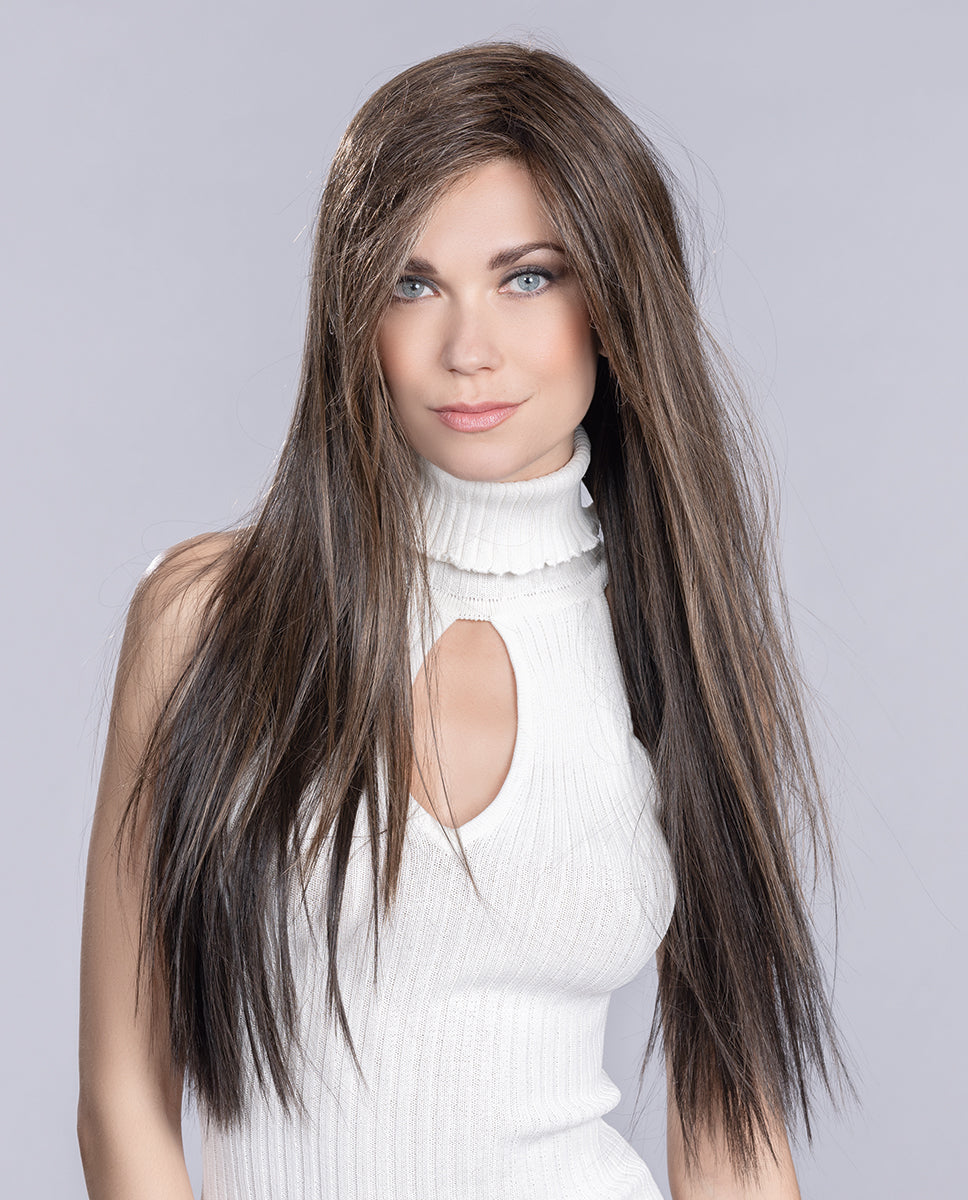 A woman modeling the extra-long Ellen Wille Look wig, showcasing its ultra-long flowing layers, heat-styled texture, and natural mini lace front hairline.