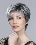 Profile view of a woman wearing the Ellen Wille Love Comfort short wig, showcasing its sporty texturized layers, clean flat nape, and natural volume.