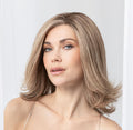 Front view of a woman modeling a premium layered human hair bob from the Ellen Wille Pure Power collection, highlighting its natural movement and seamless lace front hairline.
