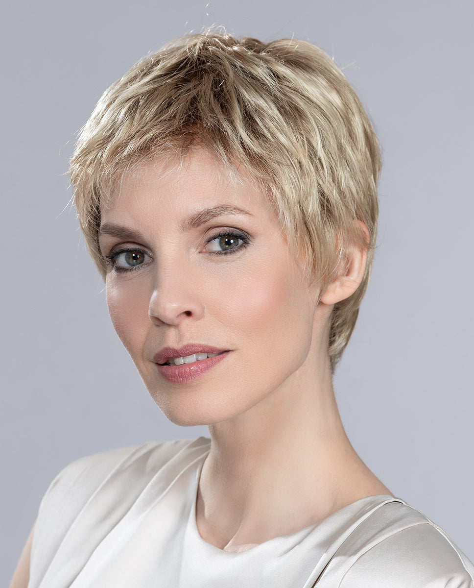 Front view of a woman modeling the Ellen Wille Risk Comfort wig, highlighting its ultra-short sporty boy cut, secure fit, and natural hand-tied movement.