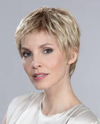Front view of a woman modeling the Ellen Wille Risk Comfort wig, highlighting its ultra-short sporty boy cut, secure fit, and natural hand-tied movement.