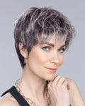 Side profile view of a woman modeling the Ellen Wille Stop Hi Tec wig, showcasing its modern tapered layers and natural built-in volume at the back.