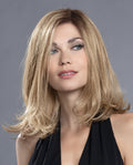 Front view of a woman modeling the long Ellen Wille Taste Mono Part wig, showcasing its below-the-shoulder layers, natural scalp parting, and soft movement.