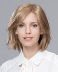 Front view of a woman modeling the Ellen Wille Tempo Large Deluxe wig, highlighting its natural movement, comfortable large cap fit, and seamless hand-tied scalp realism.