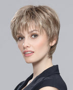 Front view of a woman modeling the Ellen Wille Vision Mono wig, showcasing its ultra-short minimalist pixie cut, smooth cropped layers, and natural scalp parting.